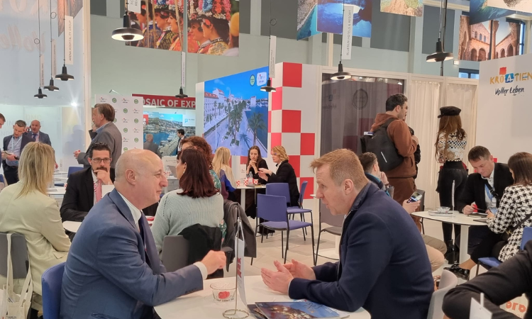 Business meetings at a busy tourism stand at the ITB Berlin trade fair