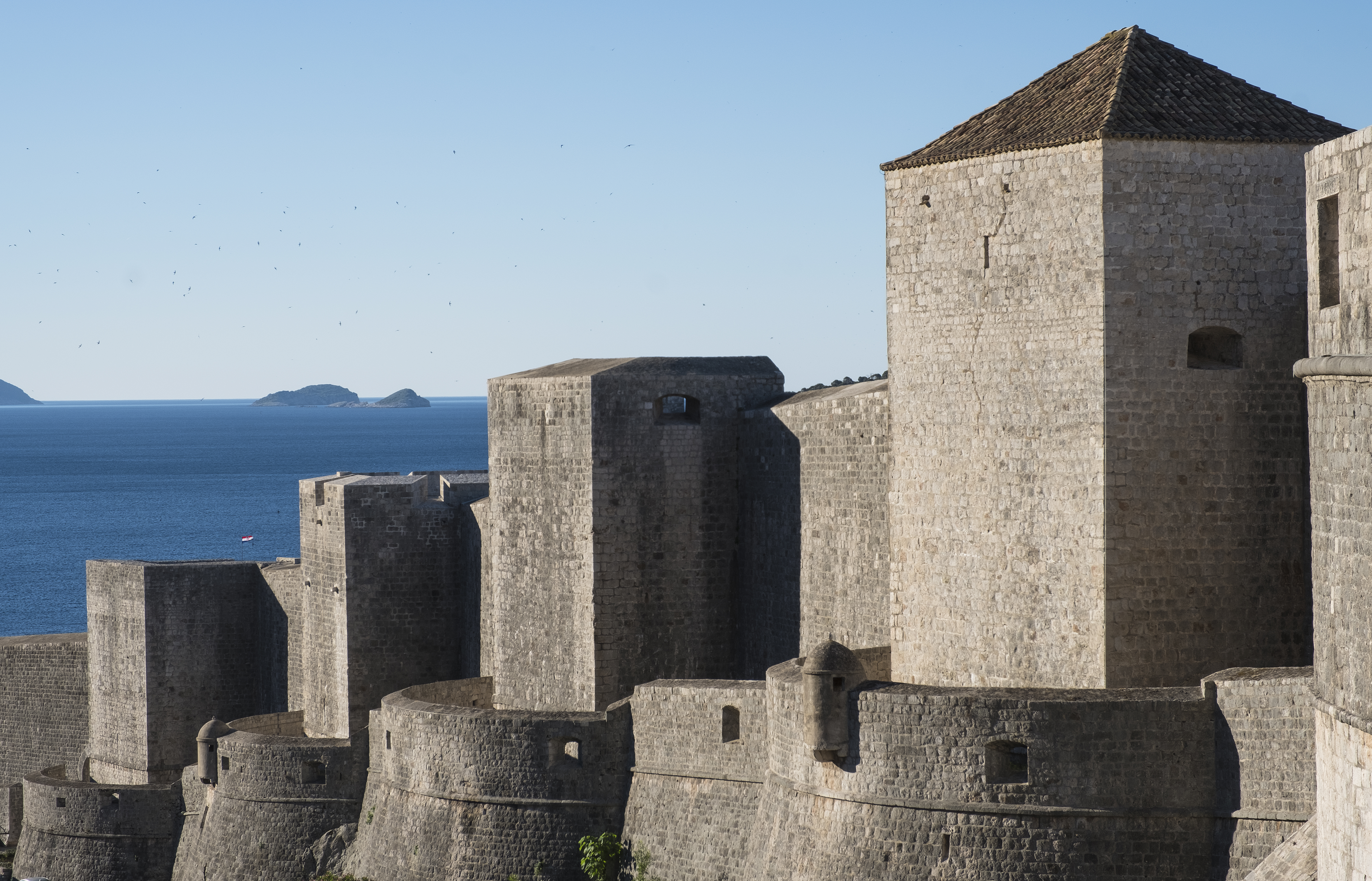 Towers of Dubrovnik's City Walls against the open sea and islands