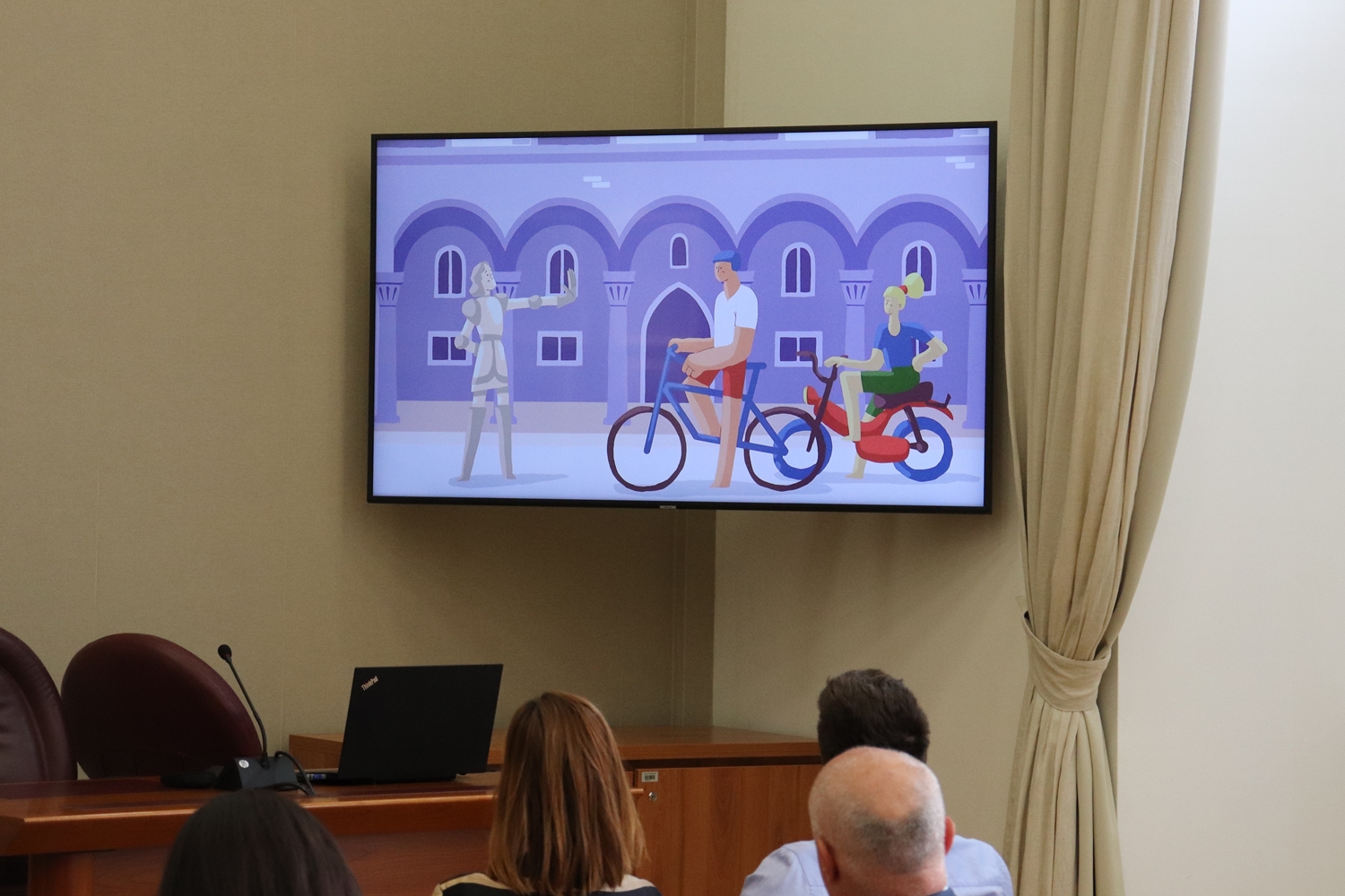 Scene from the animated Respect the City film with the Orlando statue and cyclists, shown at the presentation