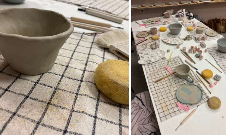 Pottery class with clay bowls, tools and rolled clay on a workshop table