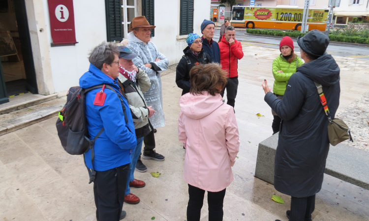 Group on a guided winter walking tour gathering outside the Tourist Information Centre at Pile