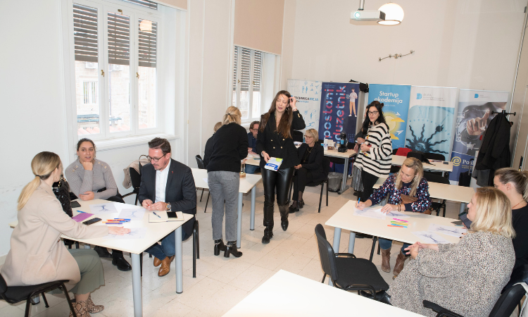 Stakeholders seated at tables during the URBACT Remote-IT local group meeting in Dubrovnik