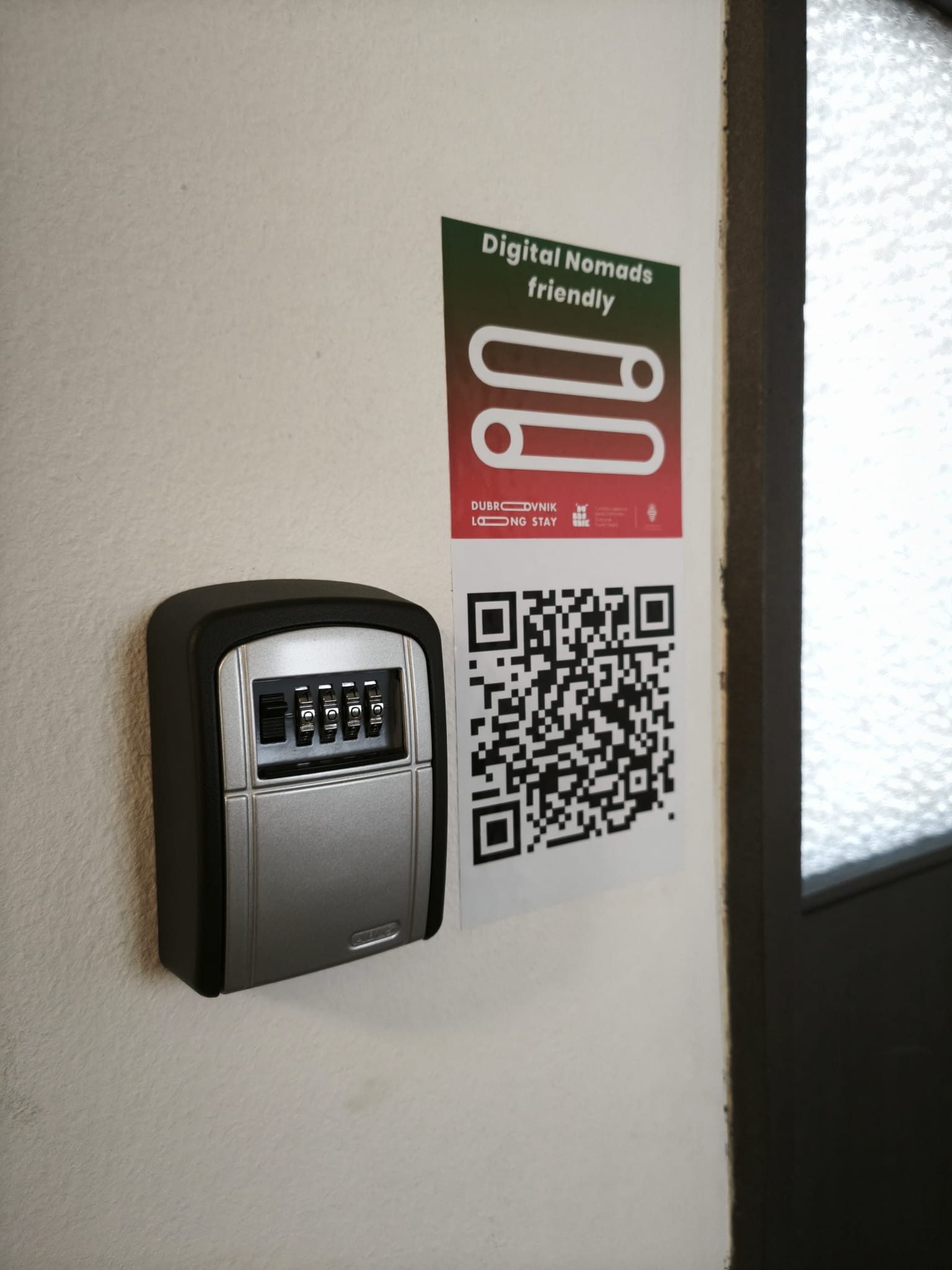 Combination key lockbox and Digital Nomads friendly sign with QR code at the TUP co-working space