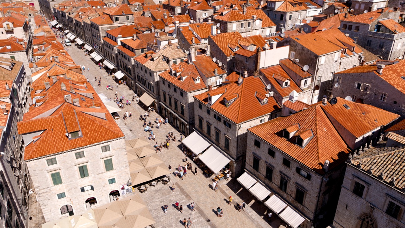 Aerial view of Stradun, Dubrovnik's main street, lined with stone houses and orange roofs